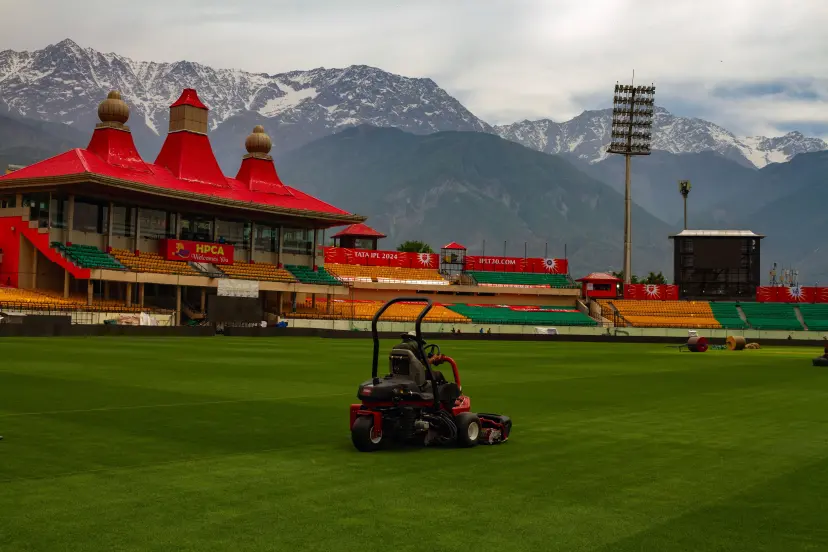 Dharamshala, Himachal Pradesh, India: Groundsman preparing the ground ahead of IPL 2024 match between Punjab Kings and Chennai Super Kings at HPCA Cricket Stadium, Dharamshala on Friday